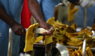 A worker steams a gloves in Pittards world class leather manufacturing company in Ethiopia's capital Addis Ababa, March 22, 2016. Picture taken March 22, 2016. REUTERS/Tiksa Negeri  - RTSDHG9