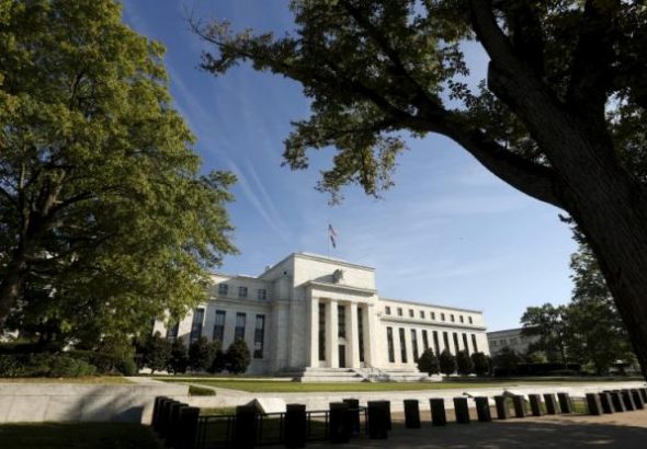 Fed keeps interest rates steady, closely watching global markets